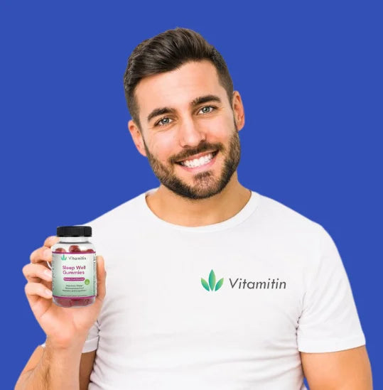 A smiling boy holding a vitamitin bottle